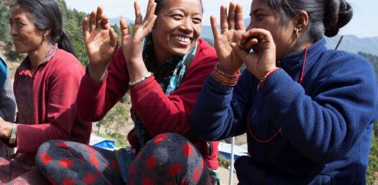 Smiling women sitting together