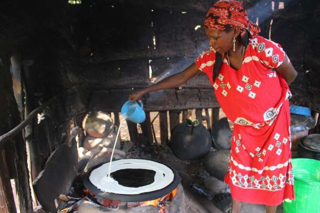 Zeritu using an improved cook stove for her new injera business in southern Ethiopia