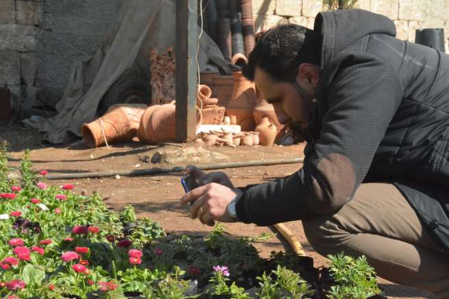 Ahmad practising taking photos as part of ‘My Syria’ photo project