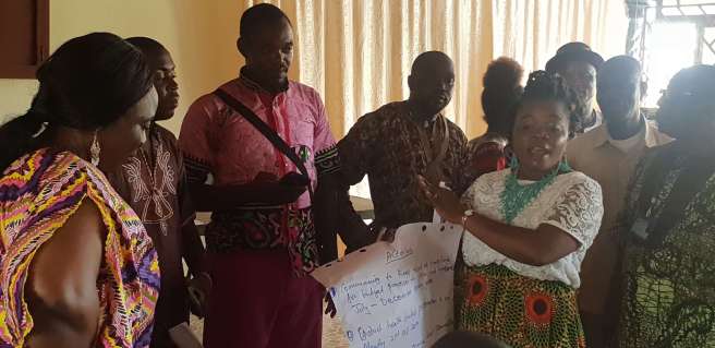 A community representatives shows the needs of her community in a meeting with duty bearers