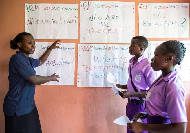 A group of women teaching about voter education