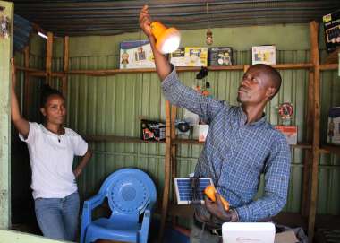 Robisha Tamiru (right) and Selamawit Eyob in their solar shop in Konso town demonstrating how their solar lamps work.