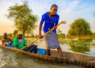 A woman in South Sudan canoeing