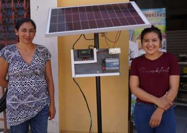 Ana Moradel and her business partner, outside their new business selling sustainable energy products. 