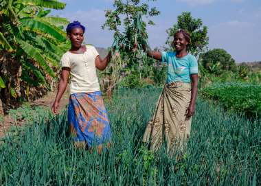 Two women showing off their latest crop